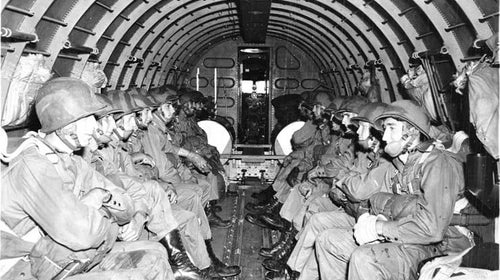 WWII paratroopers ready for drop.