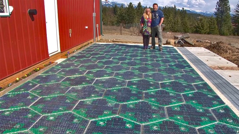 The Brusaws, standing on the prototype parking lot they built with support from the Federal Highway Administration.