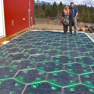 The Brusaws, standing on the prototype parking lot they built with support from the Federal Highway Administration.