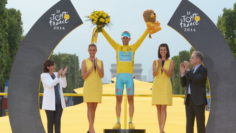 What better way to feel triumphant than on a winner's podium on front of the Arc de Triumphe?