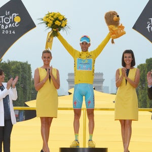 What better way to feel triumphant than on a winner's podium on front of the Arc de Triumphe?