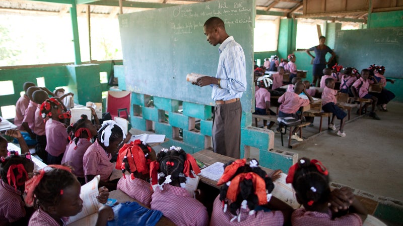 Students in adjacent classrooms at the Church of God of Savanne Tapion school.