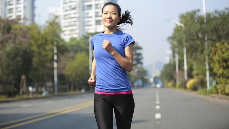 WOman asphalt road running