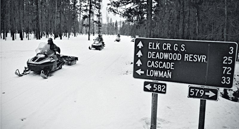 Tom Carter, co-owner of Deadwood Outfitters, pulls a gear sled during a wolf hunt in the Boise National Forest.
