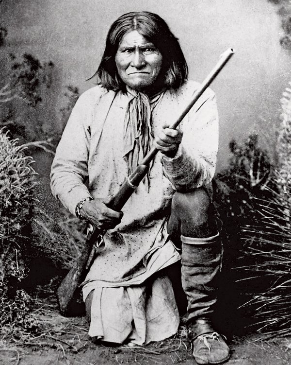 Chiricahua Apaches Clothing Cultural and ethnic dress Full-length portraits Full-length studio portraits Geronimo Holding Males People Portraits Prominent persons Rifle Studio portraits Traditional dress