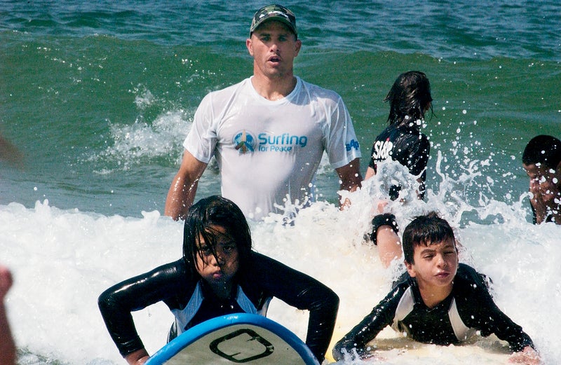 kelly slater israel tel aviv doc paskowitz surfing surfers quiksilver pro surfers surfing for peace outdoors outside classics outside magazine outside online