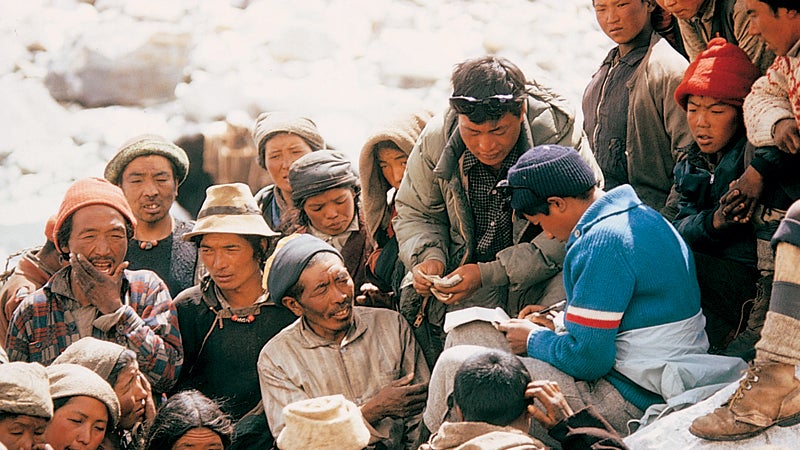 A sirdar dispenses pay at Base