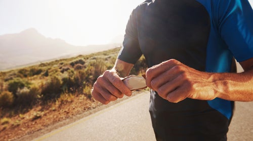 active adult athlete athletic caucasian copyspace countryside cropped eat eating energy energy bar exercise exercising fit fitness food guy health healthy jog jogging leisure lifestyle male man men nutrition one man only outdoors outside people person protein recreational pursuit road run running scenic sports sportspeople sportsperson stamina sunglasses sunny training valley