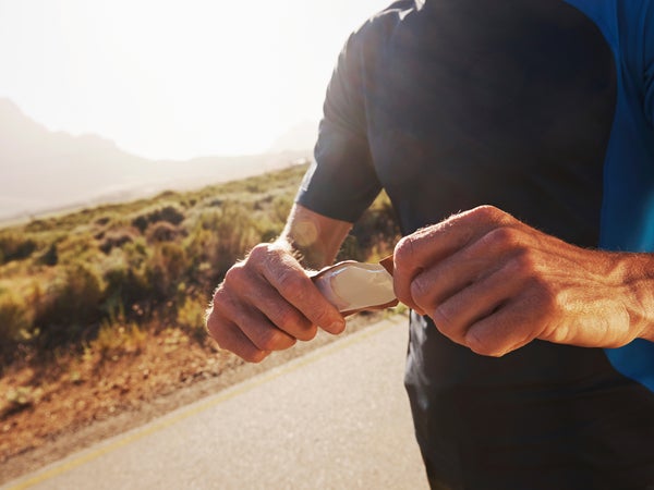 active adult athlete athletic caucasian copyspace countryside cropped eat eating energy energy bar exercise exercising fit fitness food guy health healthy jog jogging leisure lifestyle male man men nutrition one man only outdoors outside people person protein recreational pursuit road run running scenic sports sportspeople sportsperson stamina sunglasses sunny training valley