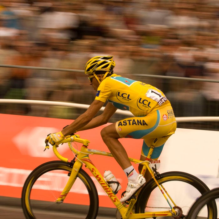 Contador cruises down the Champs Elysées toward what seemed to be his third Tour de France victory in 2010. But weeks later, his win came into question when traces of clenbuterol, a banned substance, were found in his body. He would eventually be stripped of his third Tour title.