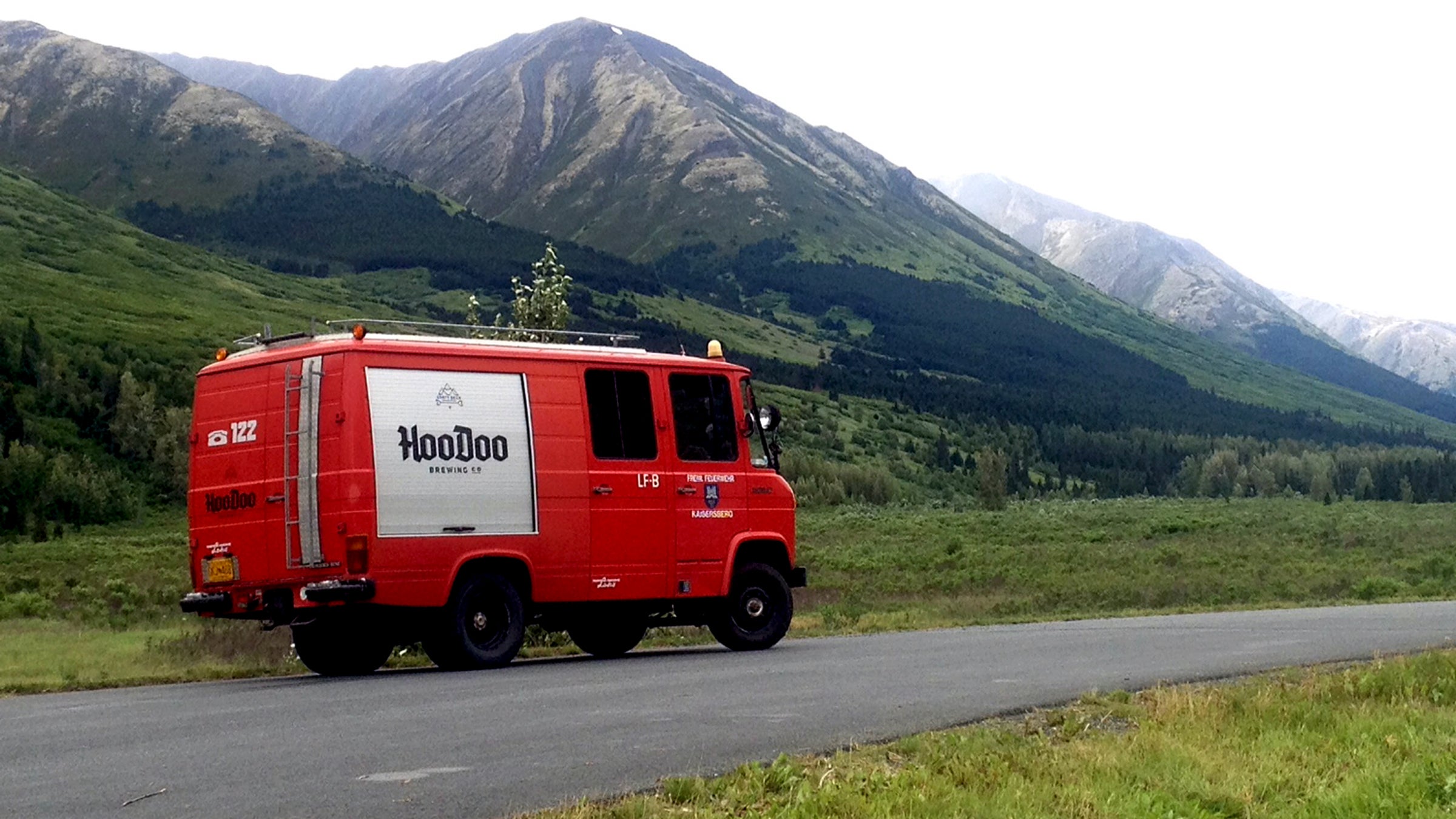 HooDoo's beer van in its natural habitat. Several people can sleep on the roof of the van.