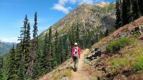 A hiker makes her way through Cutthroat Pass, a section of the Pacific Crest Trail.