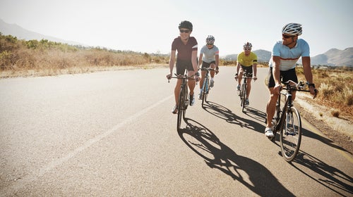 action active activity adult athlete athleticism bicycle caucasian challenge competitive sport copyspace cropped cycle cyclist determination endurance enjoyment exercise exercising female fit fitness focus goal group happiness happy health healthy horizontal lifestyle looking male man men outdoors outside people physical activity race racing bicycle riding road smile smiling sport sportswear tenacity training triathlon two people wellbeing wellness woman young young man young woman