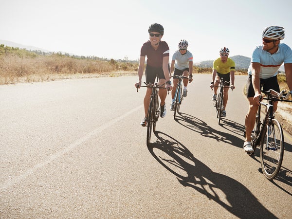 action active activity adult athlete athleticism bicycle caucasian challenge competitive sport copyspace cropped cycle cyclist determination endurance enjoyment exercise exercising female fit fitness focus goal group happiness happy health healthy horizontal lifestyle looking male man men outdoors outside people physical activity race racing bicycle riding road smile smiling sport sportswear tenacity training triathlon two people wellbeing wellness woman young young man young woman